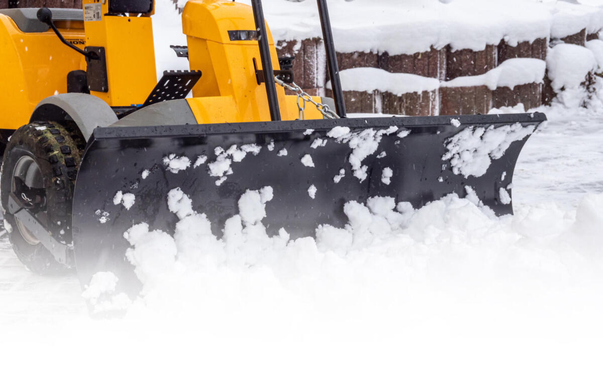 Pushing snow with a tractor”n